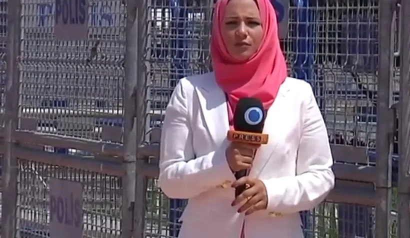 Serena reporting in front of police barriers at Taksim Square, Istanbul.